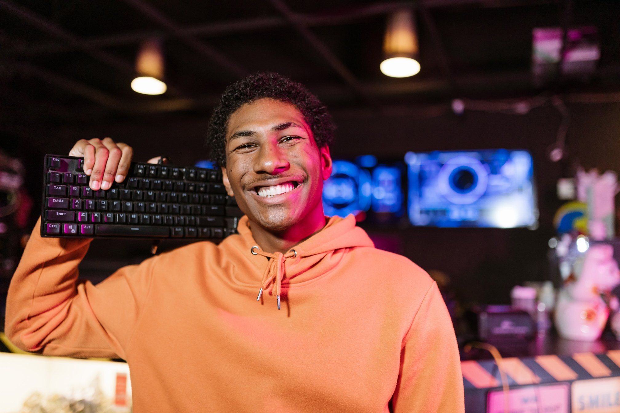 Man in Orange Hoodie Smiling